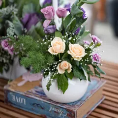 Intimate details from the 'Victorian Bageecha' theme, including vintage books, pastel floral arrangements, and elegant candles.