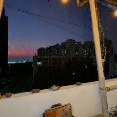 Welcome to my rooftop studio in Malad. This is the view that greets you during our evening workshops, a beautiful sunset over the city. It's the perfect, calming backdrop for getting creative with clay.