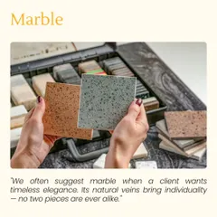 I often suggest marble for clients who want timeless elegance. Its natural veins bring individuality, as no two pieces are ever alike. Here, a client is exploring different marble samples at my studio.