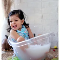 Pure happiness in a tub! Our milk bath or bubble bath photoshoots are a fantastic way to capture carefree, joyful moments in a unique and artistic setting.