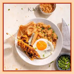 My take on the classic Nasi Goreng. This Indonesian fried rice is a complete meal, packed with flavor and served with chicken satay, a fried egg, and crispy crackers for that perfect texture.