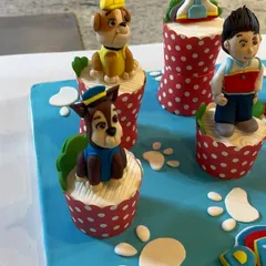A close-up shot of the handcrafted Chase and Rubble fondant toppers. We spend hours, often late into the night, to make sure every detail on these edible character models is perfect.