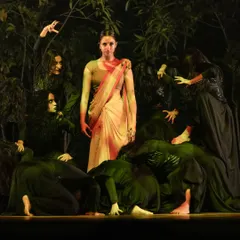 Portraying Sita surrounded by the ensemble in 'Sitayana'. Group dynamics are key in my stage work, creating powerful visual narratives through synchronized movement and character interaction.