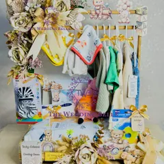 The full view of our beautiful baby shower wardrobe hamper. It's a gift that is both practical and stunningly presented.