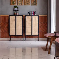 A closer look at the material palette, with the hexagonal patterned floor, rattan and metal cabinets, and the textured brickwork. Each element was chosen to contribute to the office's industrial-chic aesthetic.