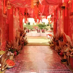 We transported guests to a different world with this Souk Bazaar themed Mehndi. The entrance, rich with layered red textiles, intricate patterns, and hanging tassels, was designed to be an immersive first step into a vibrant, cultural celebration.