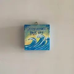 'Perseverance Pays Off'. This 4x4 inch mini canvas is a small reminder to keep going, even when the waves get rough. I hand-paint each one, making it a perfect little piece of motivational art for your workspace.