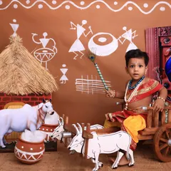 A majestic portrait of a little boy dressed as Krishna. The setup includes a bullock cart, peacock figure, and a vibrant, traditional backdrop, creating a rich and detailed scene.