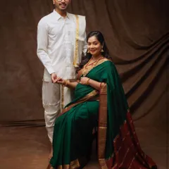 An elegant maternity portrait celebrating South Indian heritage. The couple's traditional veshti and saree create a graceful and culturally rich photograph.