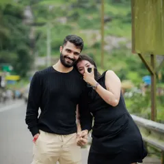 Holding hands and sharing a quiet, happy moment. I encourage couples to interact naturally, and my job is to find the perfect angle to capture that connection.