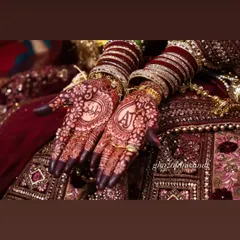 I love adding personal touches like the bride and groom's initials. This design shows the beautiful dark stain of the henna, with the initials 'AJ' and 'Batin' elegantly placed for a memorable touch.