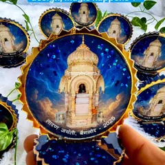 "When devotion meets design, magic happens." This image shows a collection of custom souvenirs I created for the Taran Jayanti festival. The deep blue and gold design reflects a sense of divinity and celebration.