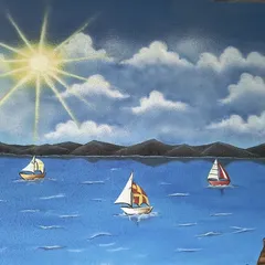 The details of the sun, clouds, and sailboats on the water.