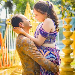 The playful romance of a Haldi ceremony. Tirath lifts Nelya, and in that moment, it's just the two of them in a world of yellow.