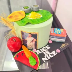 I had the honor of creating this themed cake for celebrity nutritionist Rujuta Diwekar. The design includes edible models of healthy foods, her book, and a personal photo, reflecting her brand and work.
