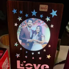This wooden LED frame features a central photo surrounded by glowing stars and the word "Love". It's a wonderful gift for your partner to light up their desk or bedside table.