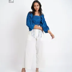 A full-length shot that provides customers with a clear view of the entire outfit's silhouette and proportions.