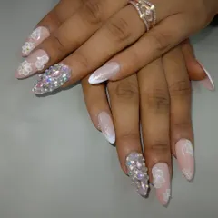 A stunning bridal look combining 3D floral accents with nails completely covered in sparkling rhinestones for maximum impact. This set is pure glamour and perfect for a wedding reception.