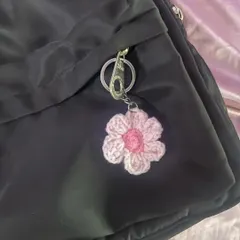 Here’s my two-toned flower keychain on a backpack. It adds such a cute, coquette vibe to a simple black bag.