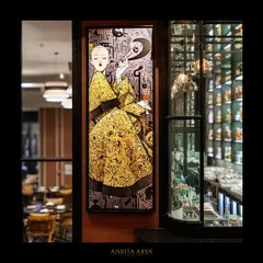 Another piece of oriental pop art designed for Shanghigh. This artwork features a stylish figure in a detailed yellow robe, adding a touch of modern flair and sophistication to the bar area.