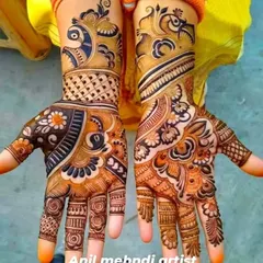 The vibrant orange stain of this fresh mehandi shows the quality of my organic paste. This design features bold peacock figures at the wrist and dense floral work on the palms.