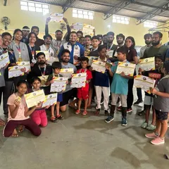 The whole team celebrating their achievements. This group of kids and adults earned their medals and certificates through pure dedication. This is the result of consistent training.