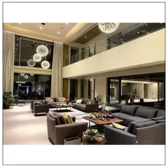 We believe a living room should be an oasis of comfort and style. For this home in Aamby Valley, we designed a double-height space with a dramatic chandelier and plush seating to create a beautiful blend of contemporary and cozy design elements.