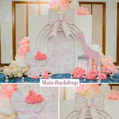 For this special baby welcome, the family wanted something truly luxurious, so I designed this Dior-inspired main backdrop. The intricate details, soft pink and white palette, and custom-made props like the baby carriage created an atmosphere of pure elegance.