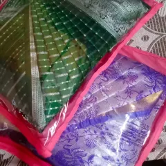 Two sarees packed in custom bags after pleating. This not only keeps them neat but also makes them perfect for gifting or travel.