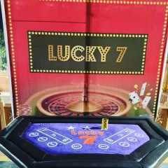 Another popular choice for our casino themed parties is the 'Lucky 7' game table. It comes with a themed backdrop and all necessary accessories for a fun night of games.