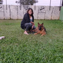 A happy German Shepherd and his owner, ready to start their new life together after graduating from my program.