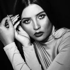 A powerful black and white portrait. For this type of photography, I focus on contrast, creating depth with contouring and defining the eyes and lips to stand out in a monochromatic format.