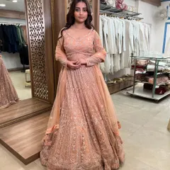 Another view of the full peach lehenga, a versatile and beautiful pre-loved outfit for any festive occasion.