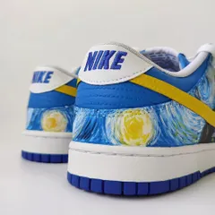A detail shot of the heel, showing the glowing moons from "Starry Night." Even the back of the shoe is part of the canvas.