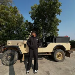 Me with a classic jeep. It's got that raw, rugged, and timeless feel, just like the desi hip hop I grew up on.