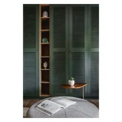 A close-up of the wardrobe, showing the contrast between the deep teal finish and the warm, natural wood of the display shelf.