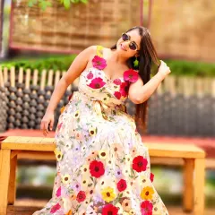 A relaxed moment during a fantastic Haldi function. The floral dress and sunny vibe are perfect for a daytime celebration filled with fun and laughter.