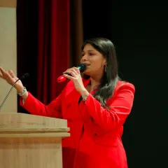 On stage hosting the SRCC Business Conclave, Asia's largest undergraduate management fest. I am adept at handling formal and academic events with professionalism.