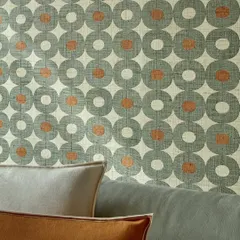 A graphic universe woven in raffia. This bold, bright, and richly artisanal wallpaper from Élitis celebrates the poetry of shape and shade, transforming walls into textured works of art with its repeating circular pattern.