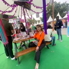 I love taking our skills outside the studio. Here I am at our stall during the Boho Bazaar in Delhi, getting ready to do some fun face and nail art for the festival-goers.