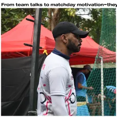 A coach observing a match, ready to provide motivation and guidance. Our coaches are our players' biggest supporters.