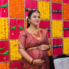 A beautiful, happy portrait from her baby shower. The makeup is designed to look fresh and natural, perfect for celebrating this special milestone.