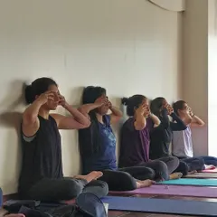 A moment of collective stillness as we practice Bhramari (Humming Bee Breath), a pranayama technique that soothes the nervous system.