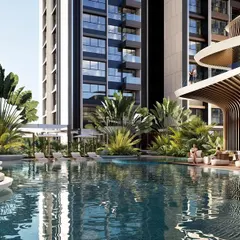 The main pool area of the multi-level clubhouse. The design features a large resort-style pool, comfortable lounge chairs, and a woven cabana, all set against the backdrop of the parametrically designed building.