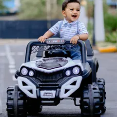 Having a blast in a mini toy truck! I use fun props like this to let kids play and capture their genuine excitement during the photoshoot.