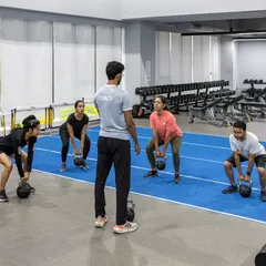 Our Strength Training for Runners program focuses on building a resilient and powerful body. Here, our coach guides a group through kettlebell exercises designed to improve running economy and prevent injuries. We believe in training smarter to help you achieve your running goals.