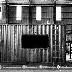 A customized structure takes shape in our workshop. This image shows a container with cutouts for large windows and doors, ready for the next stage of fabrication.