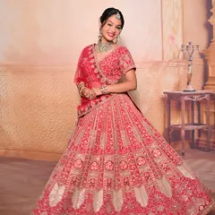 A full-length shot of a classic red bridal lehenga look. We teach not just makeup and hair, but also how the complete look comes together with draping and styling.