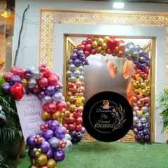 The entrance to the 25th-anniversary party venue. I created a balloon arch over the doorway and a matching welcome display to ensure the celebration started from the moment guests arrived.