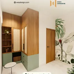 This corner showcases smart storage with a two-tone wardrobe in wood and sage green, featuring cane-fronted doors that add texture and lightness.